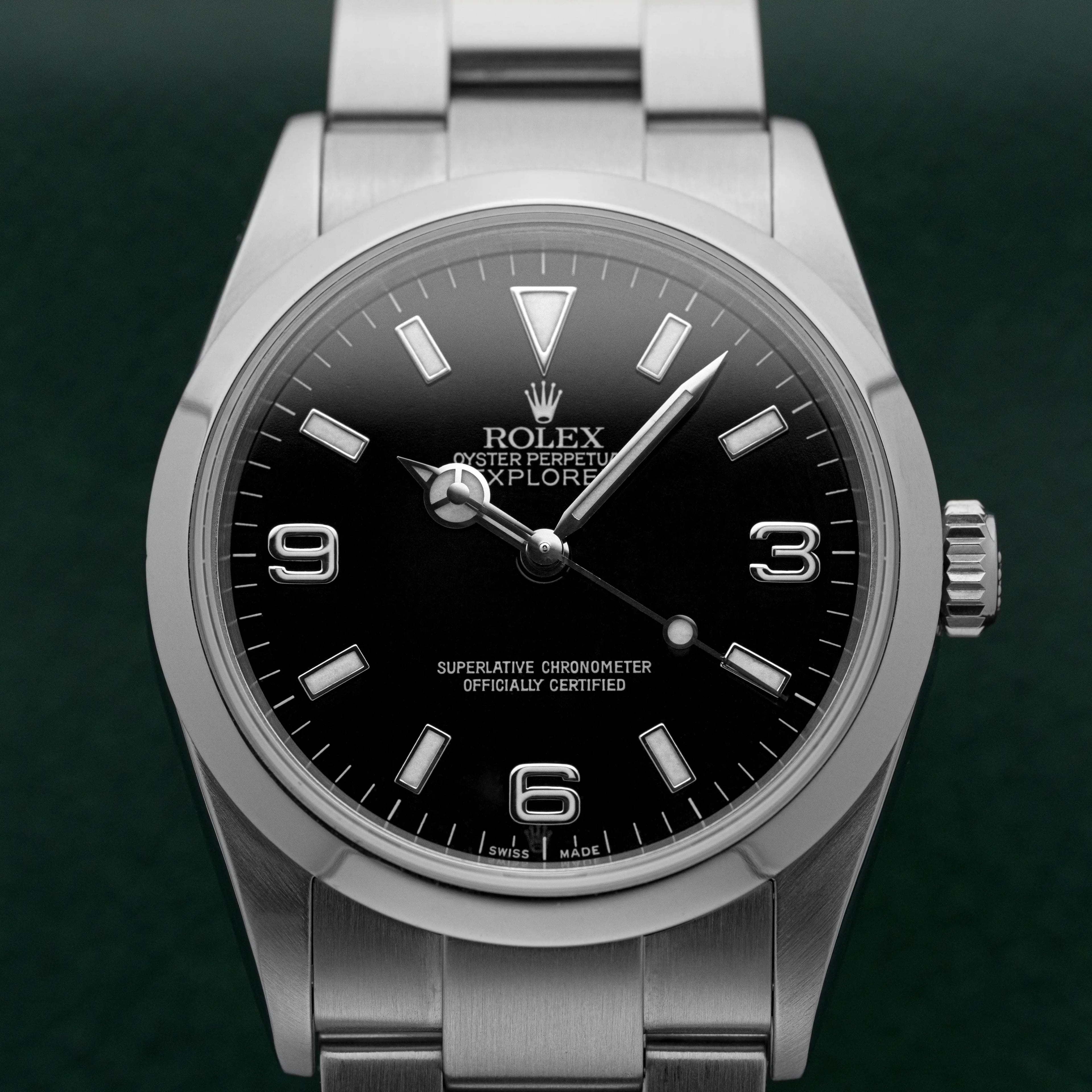 Rolex Explorer 114270 black dial with 3-6-9 numerals and luminous markers on stainless steel Oyster bracelet, front view