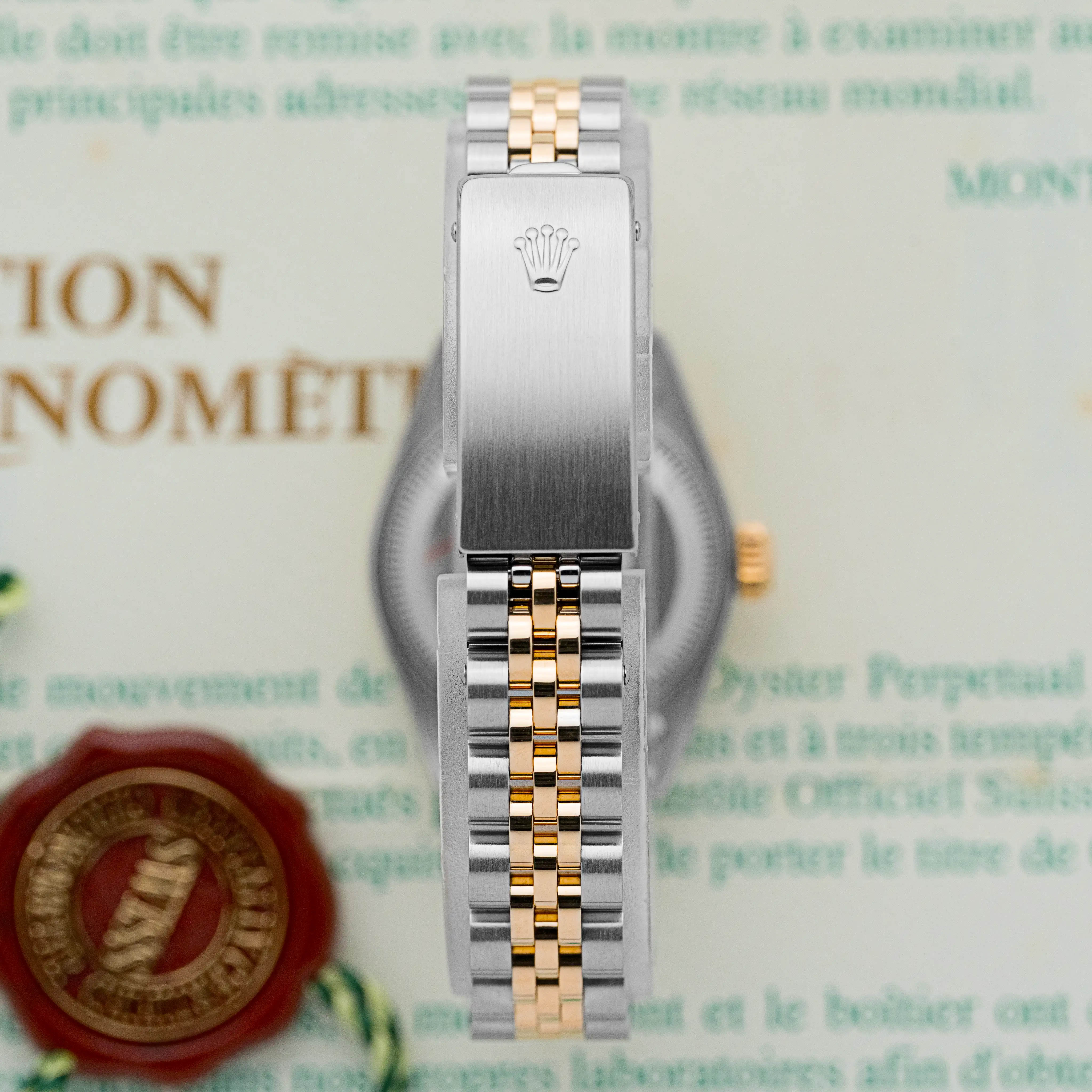 Close-up of the Rolex two-tone Jubilee bracelet clasp with engraved crown logo.